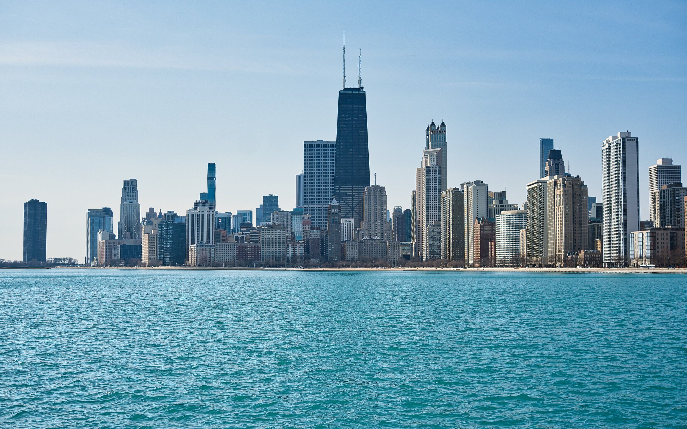 Chicago's lakefront skyline beside the blue water of Lake Michigan